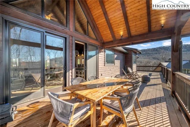a view of balcony with wooden floor
