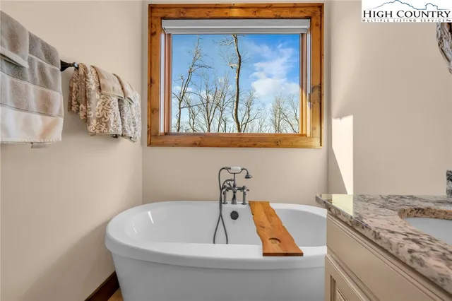 a living room with a couch and a rug