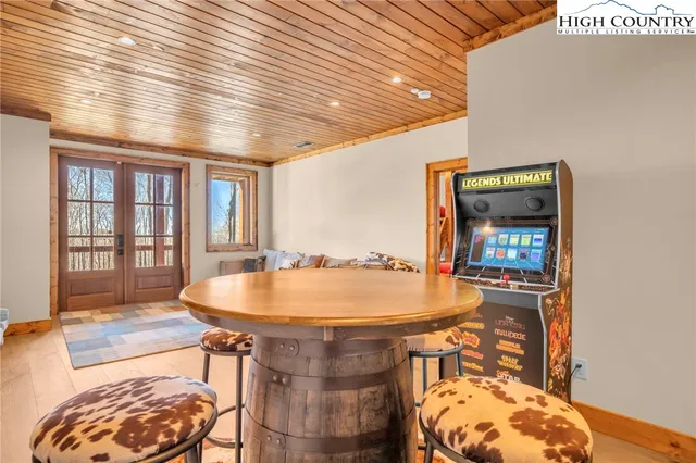 a spacious bedroom with a bed and a large window with outer view