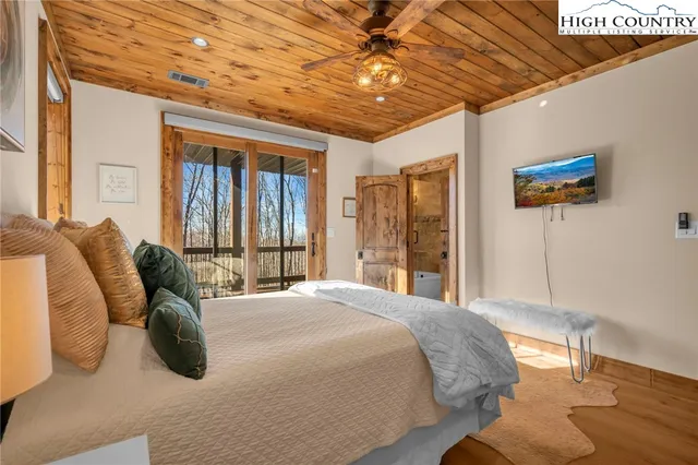a bathroom with a granite countertop bathtub shower sink and toilet