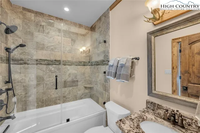 a bedroom with furniture and window