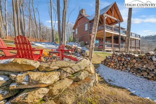 a very nice looking room with a large window and furniture