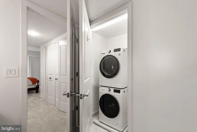 a view of a hallway with washer and dryer