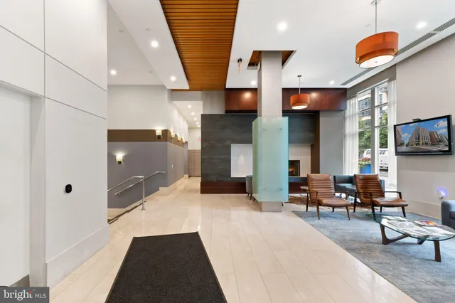 a lobby with furniture and flat screen tv