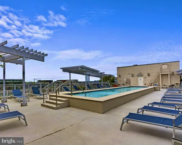 a view of a patio with swimming pool table and chairs