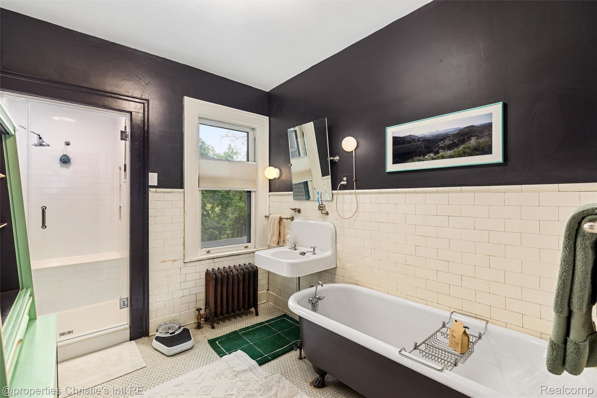 36 Longfellow Street Detroit, MI 48202 - Photo 49 of 81 Full bath featuring tile walls, wainscoting, a shower stall, a freestanding bath, and tile patterned flooring