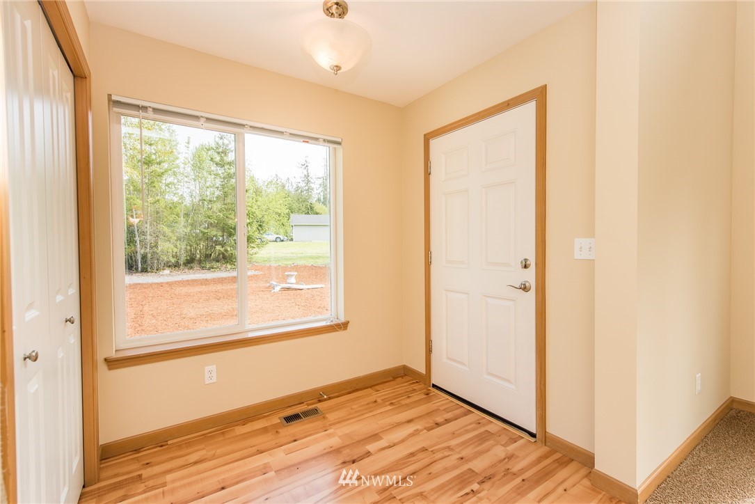 86 Hidden Valley Road Port Angeles, WA 98362 - Photo 14 of 23 a view of empty room with wooden floor and fan