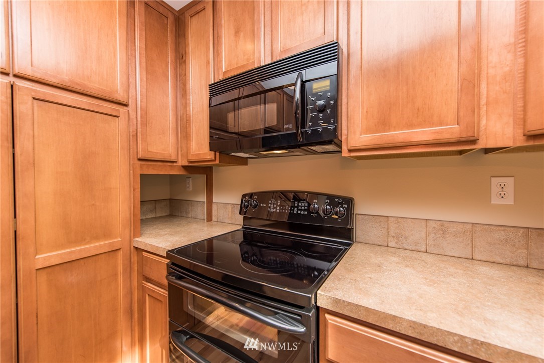 86 Hidden Valley Road Port Angeles, WA 98362 - Photo 17 of 23 a kitchen with a stove and a microwave