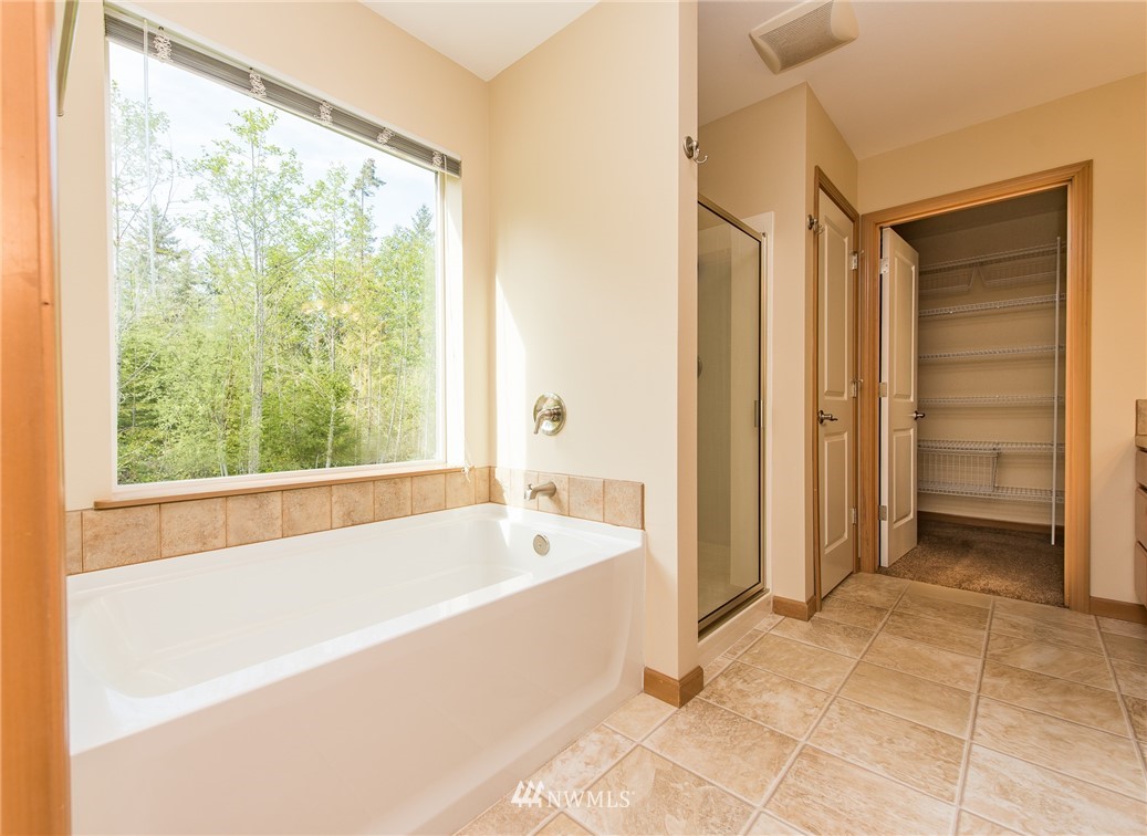 86 Hidden Valley Road Port Angeles, WA 98362 - Photo 19 of 23 a spacious bathroom with a bathtub and a shower