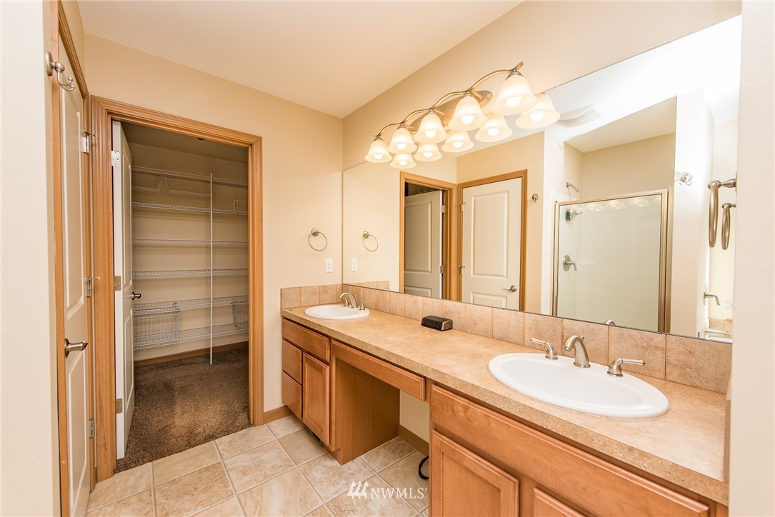 86 Hidden Valley Road Port Angeles, WA 98362 - Photo 20 of 23 a bathroom with a sink a vanity and a mirror