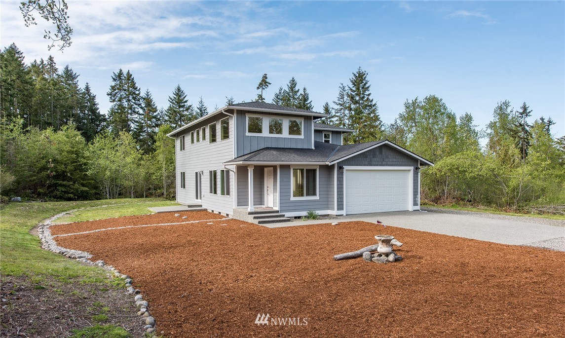 86 Hidden Valley Road Port Angeles, WA 98362 - Photo 5 of 23 a front view of a house with a yard