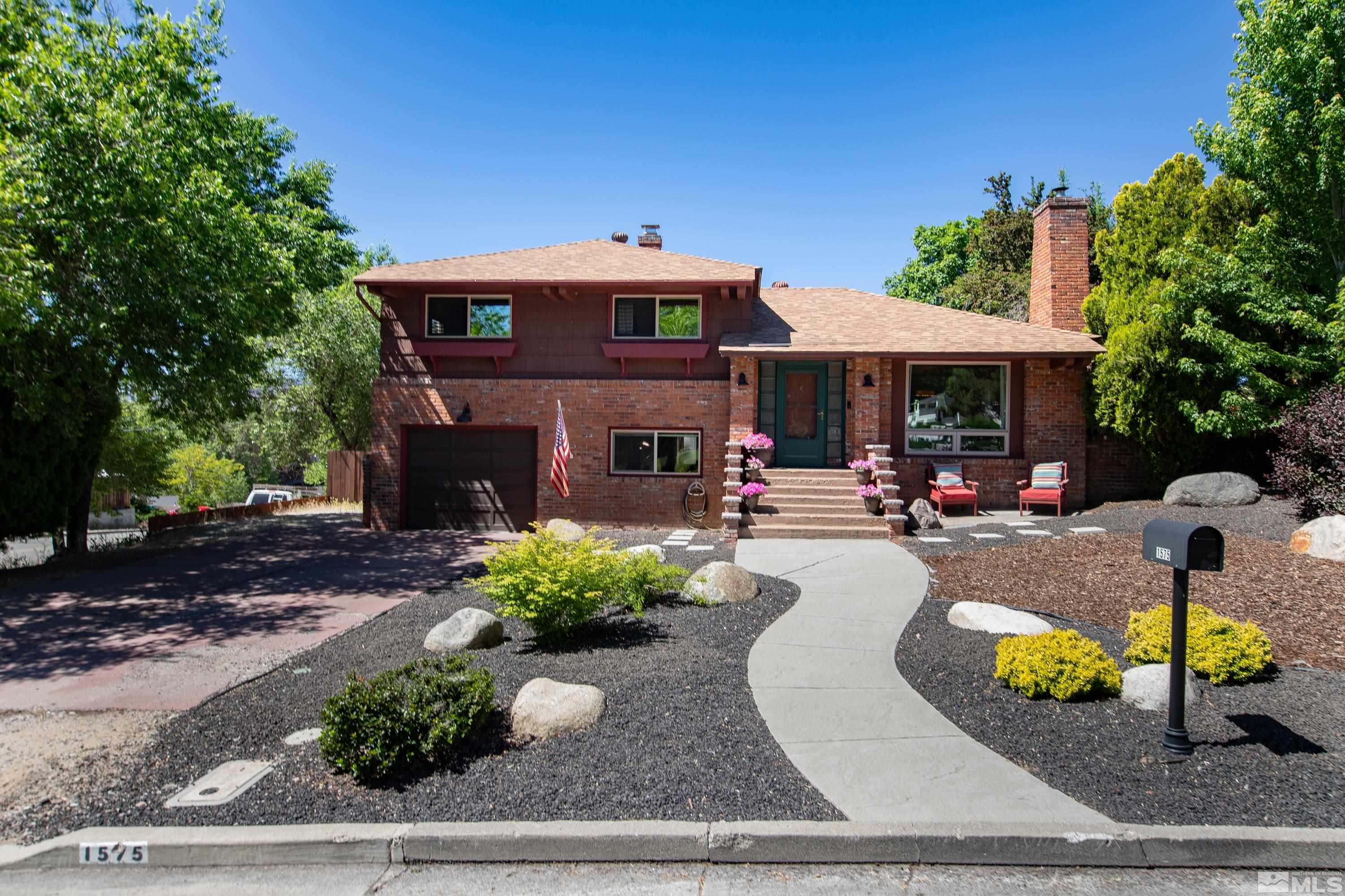 1575 Wesley Drive Reno, NV 89503 - Photo 1 of 40 a swimming pool view with a seating space