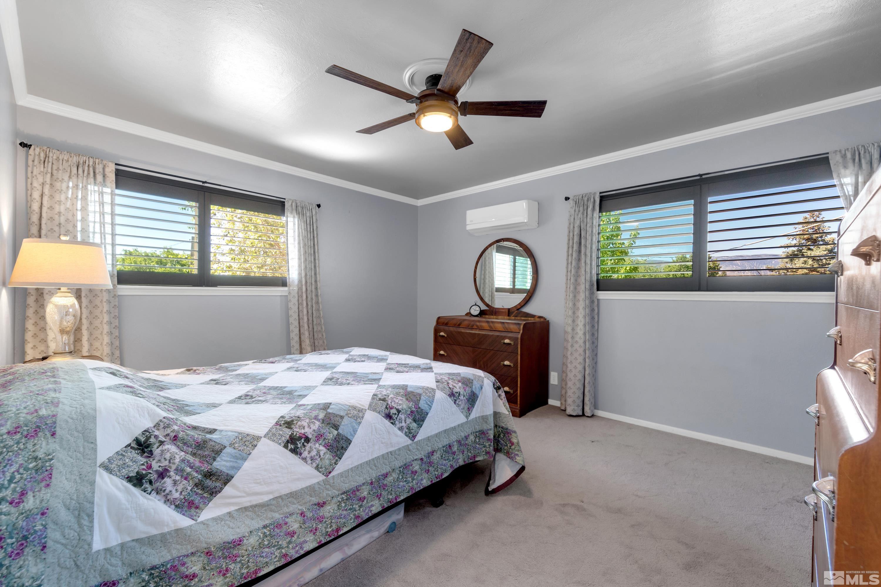 1575 Wesley Drive Reno, NV 89503 - Photo 17 of 40 a bedroom with a bed and window