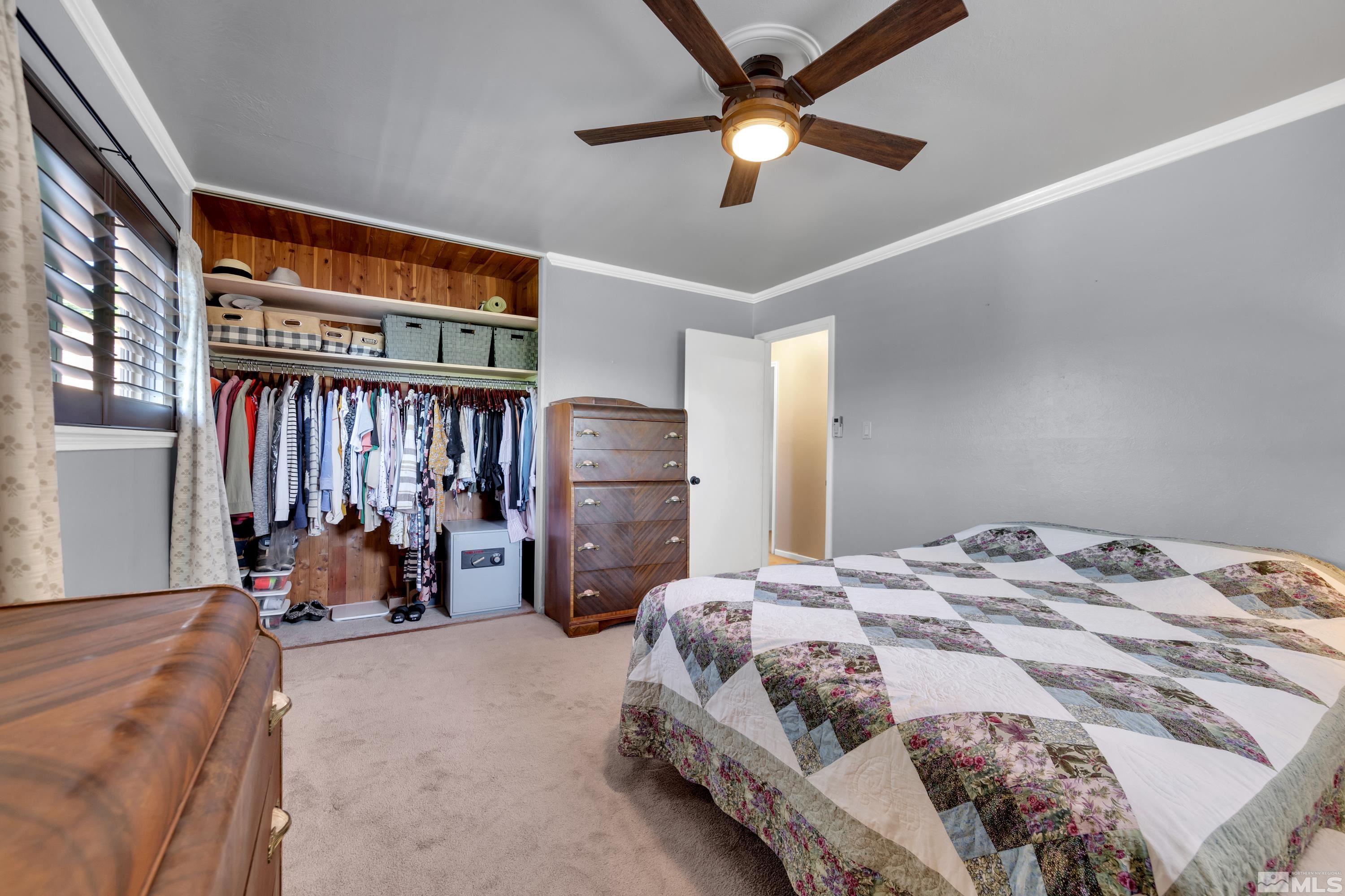 1575 Wesley Drive Reno, NV 89503 - Photo 18 of 40 a bedroom with a bed and a large window
