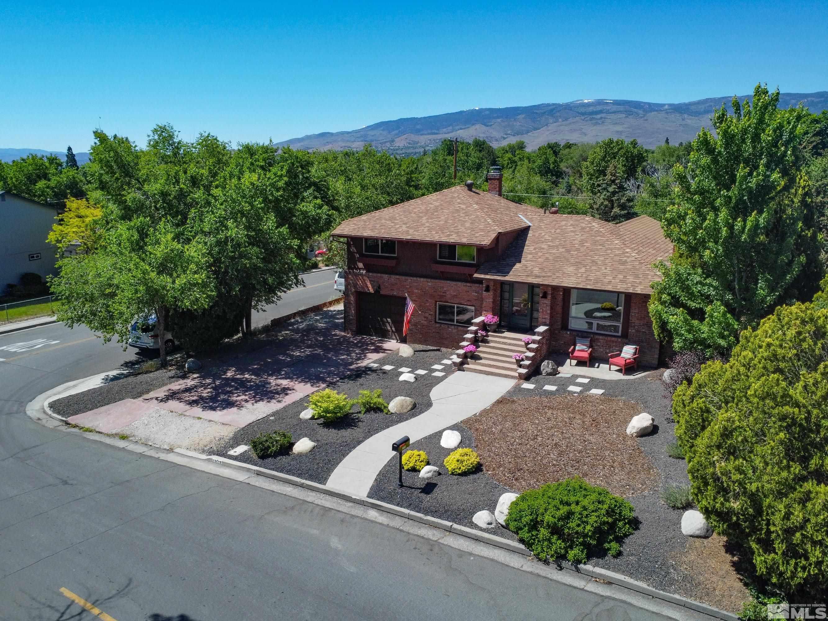 1575 Wesley Drive Reno, NV 89503 - Photo 2 of 40 an aerial view of a house with yard and lake view