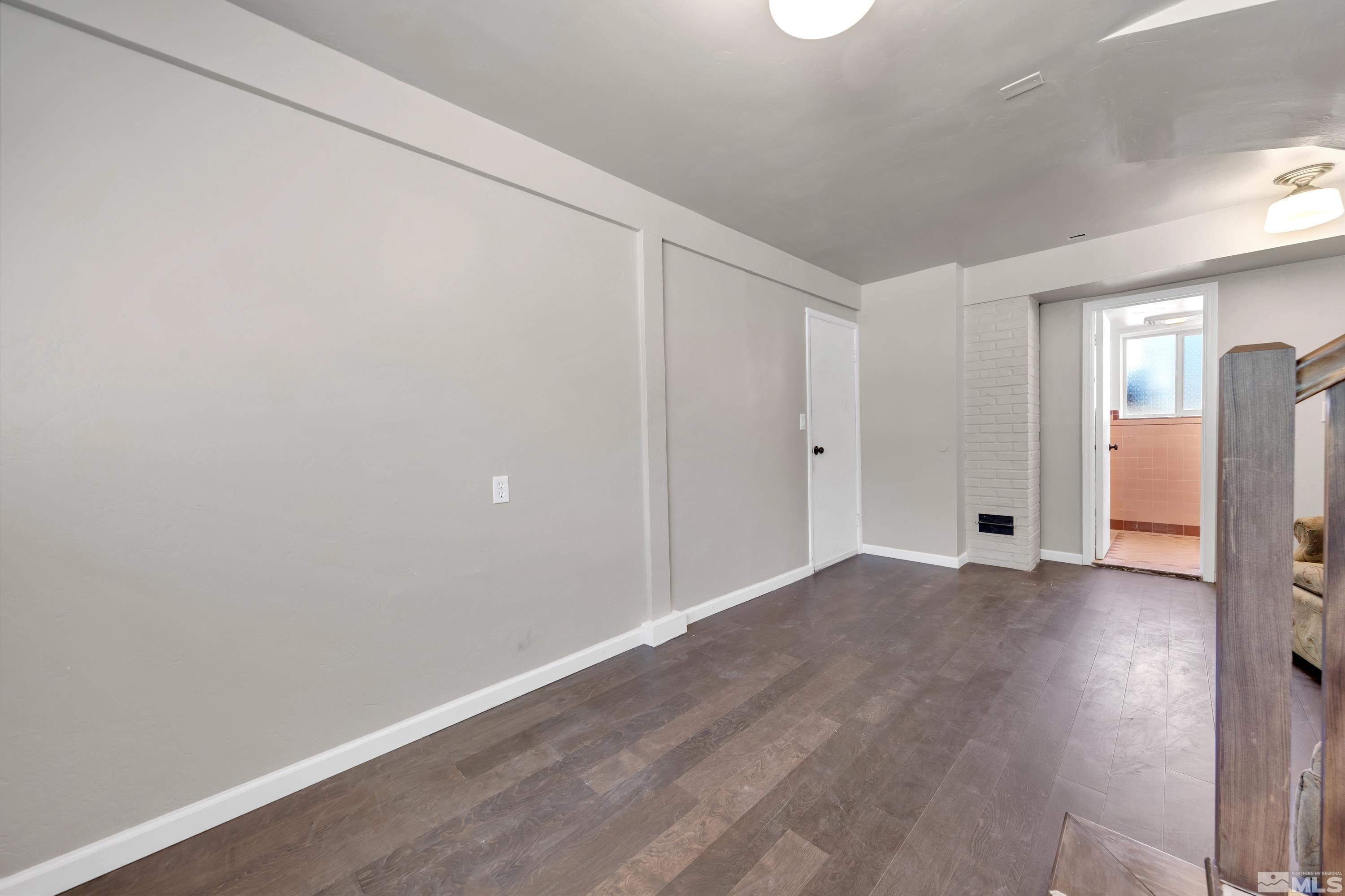 1575 Wesley Drive Reno, NV 89503 - Photo 23 of 40 a view of an empty room with wooden floor