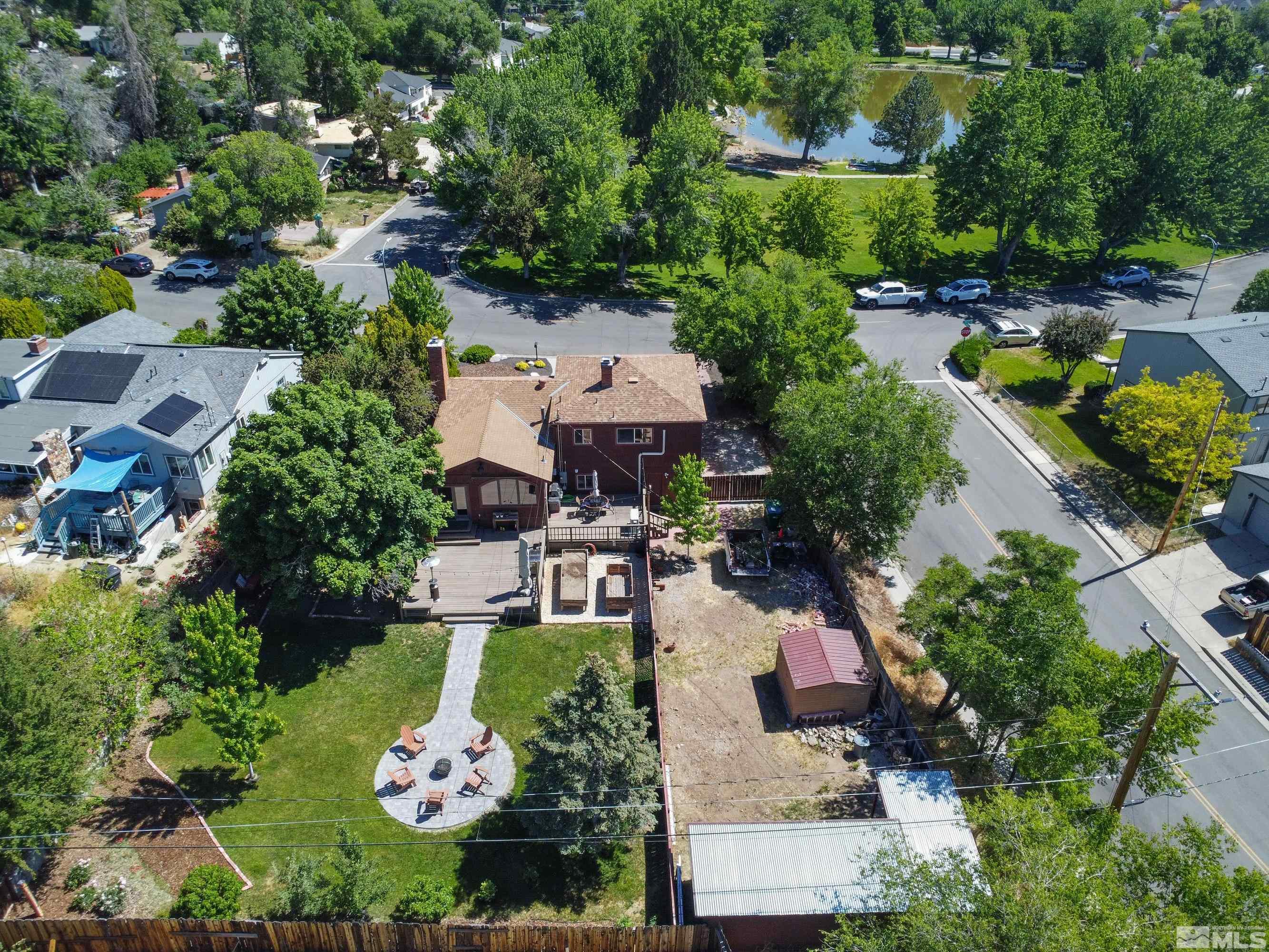 1575 Wesley Drive Reno, NV 89503 - Photo 3 of 40 an aerial view of a house with a garden and lake view