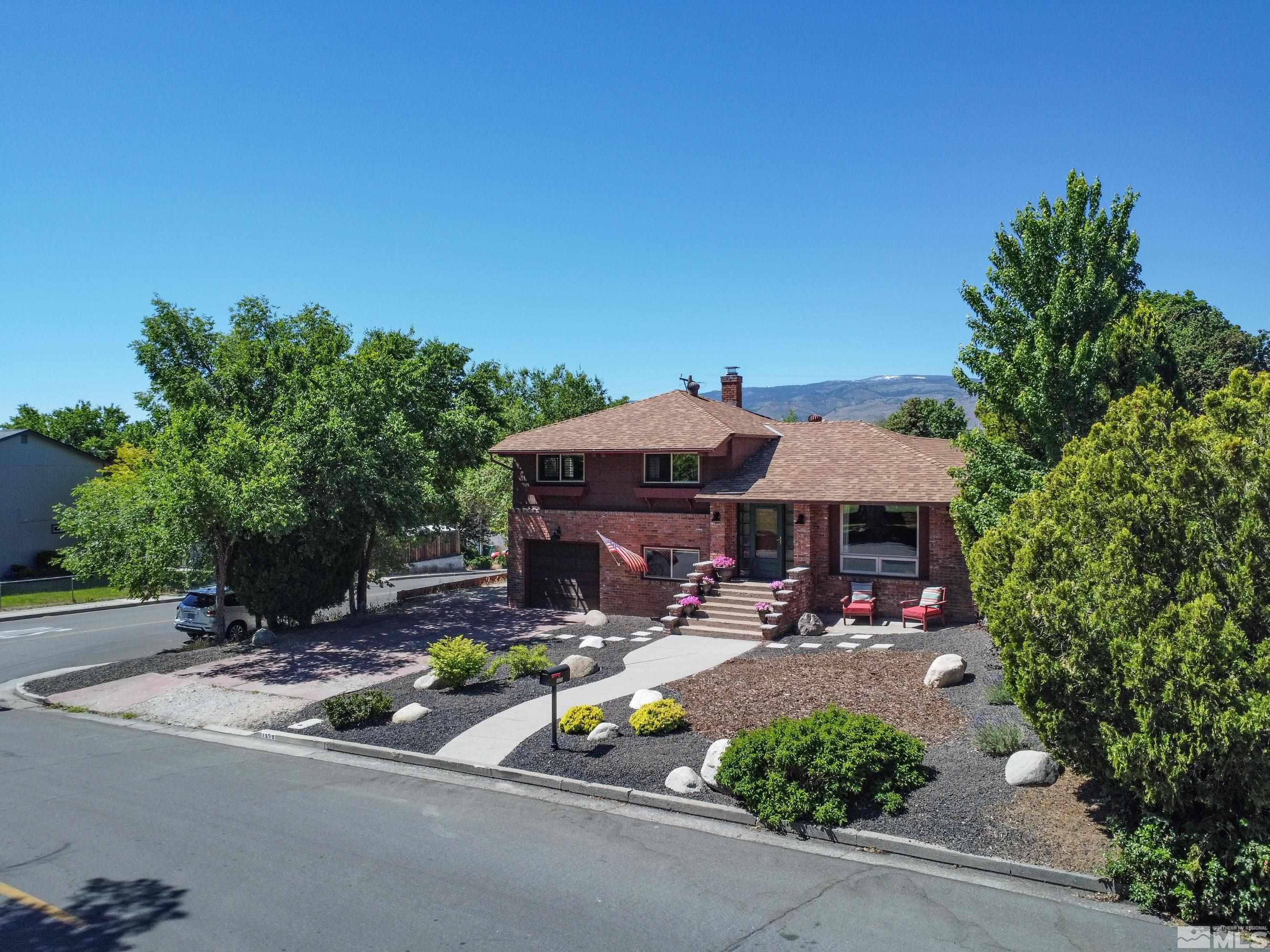1575 Wesley Drive Reno, NV 89503 - Photo 39 of 40 a view of the patio with table and chairs under an umbrella
