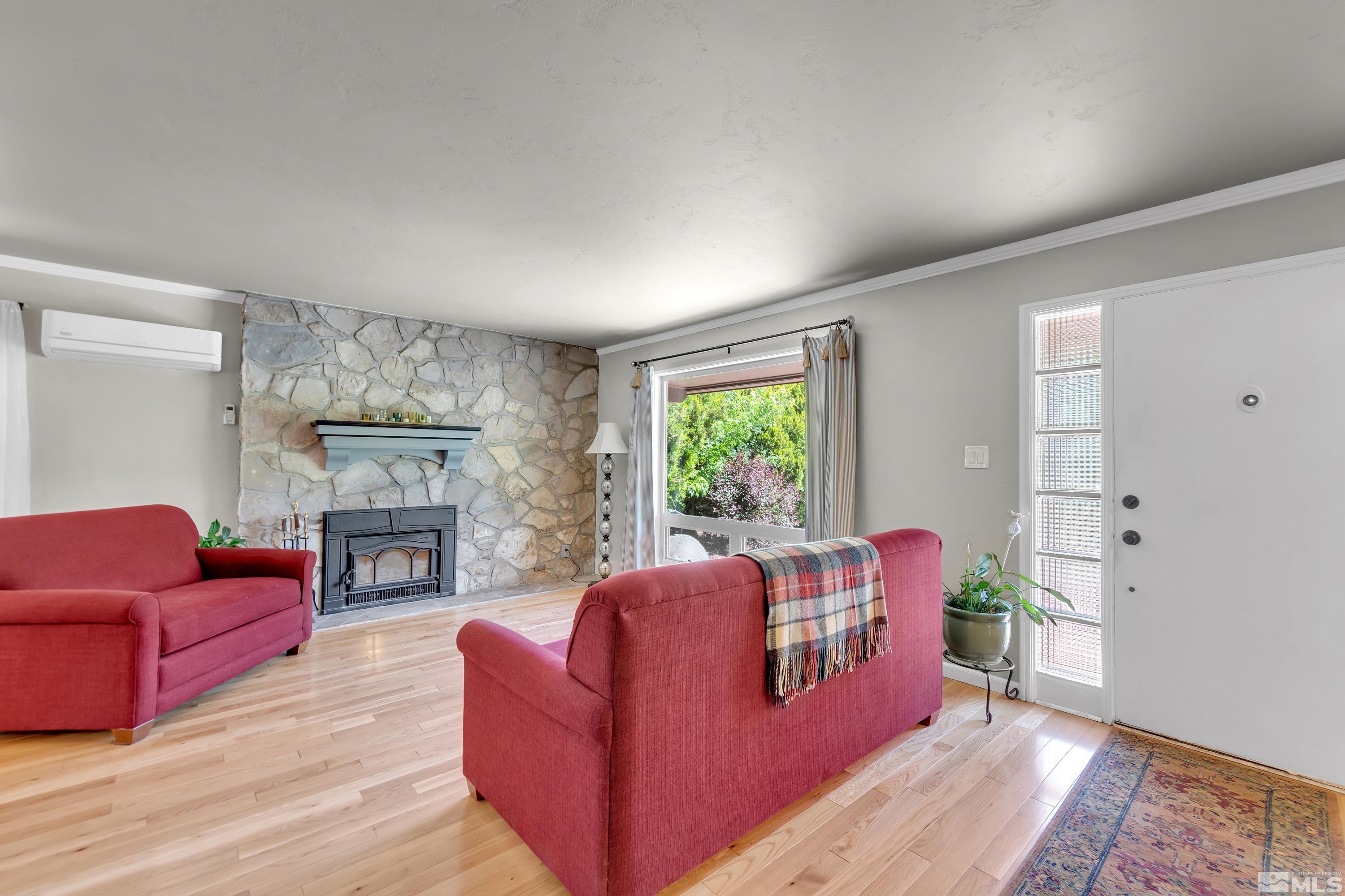1575 Wesley Drive Reno, NV 89503 - Photo 4 of 40 a living room with furniture and a fireplace
