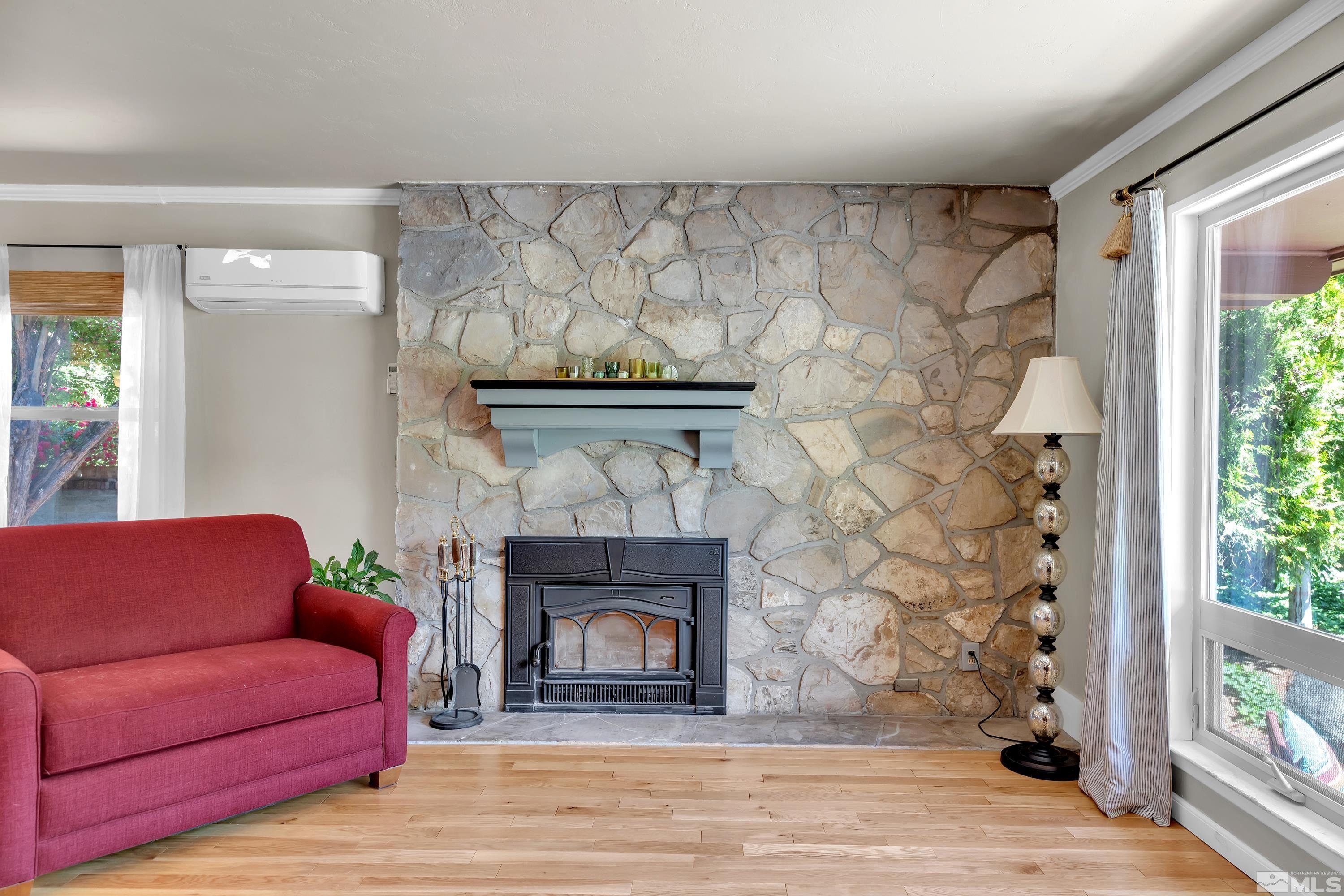 1575 Wesley Drive Reno, NV 89503 - Photo 5 of 40 a living room with furniture and a fireplace