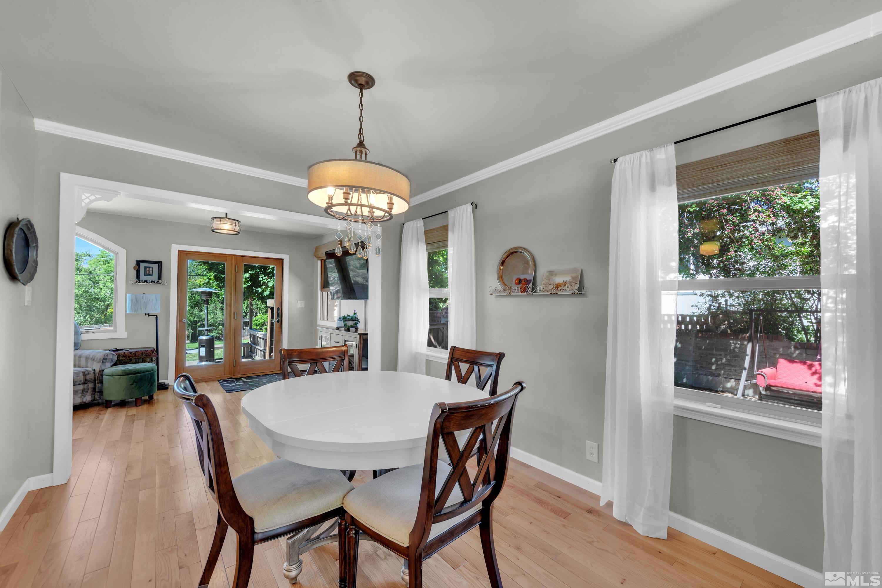 1575 Wesley Drive Reno, NV 89503 - Photo 8 of 40 a view of a dining room with furniture window and wooden floor