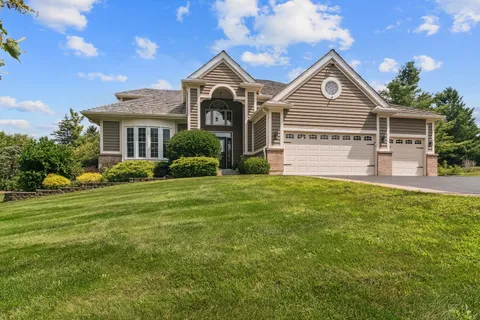 a front view of a house with a yard