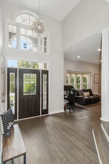 a view of a livingroom with furniture window and wooden floor