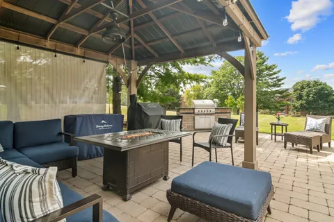 a patio with a table and chairs