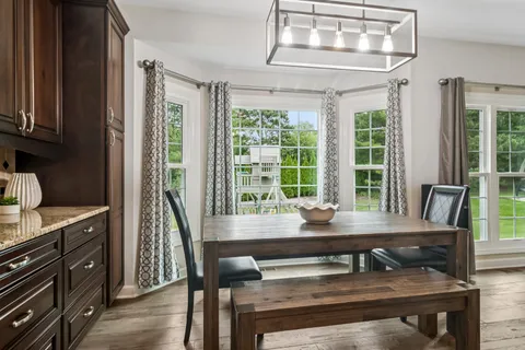 a kitchen with a stove a sink and a wooden cabinets