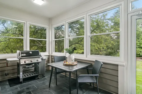 a view of a dining room with furniture window and outside view