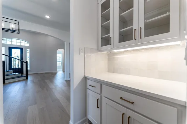 a view of a kitchen cabinets and a wooden floor