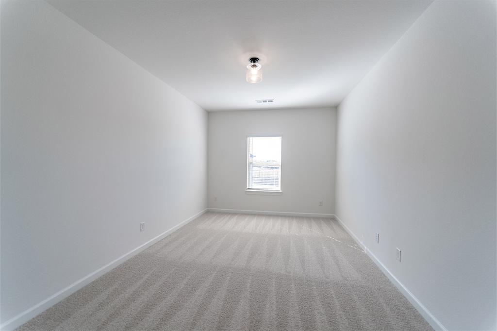 3912 Friendship Court Forney, TX 75126 - Photo 17 of 28 a view of an empty room with a window