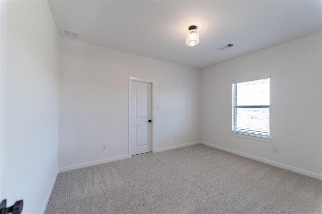 3912 Friendship Court Forney, TX 75126 - Photo 19 of 28 an empty room with a window