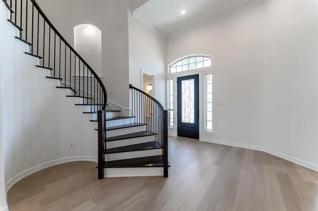 a view of entryway with wooden floor