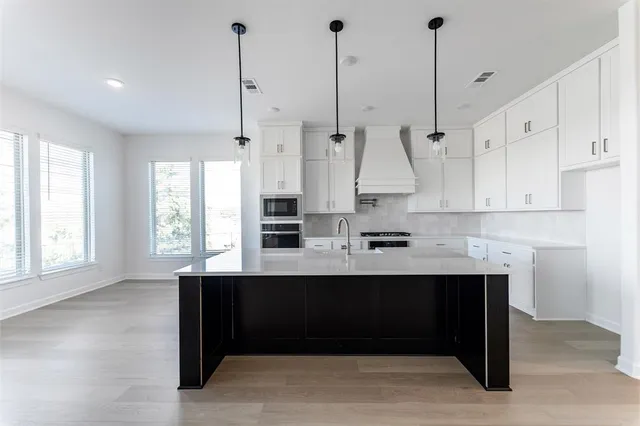 a room with wooden floor and window