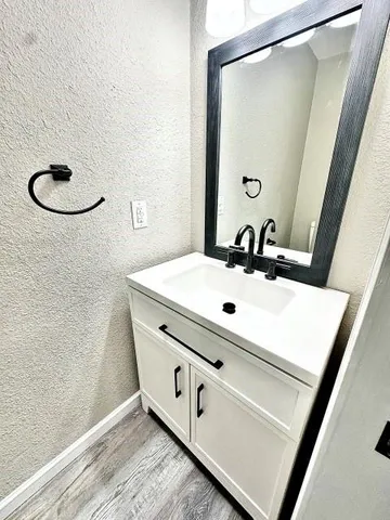 a bathroom with a sink and mirror