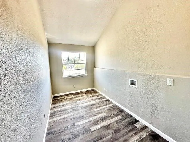 a view of an empty room and window