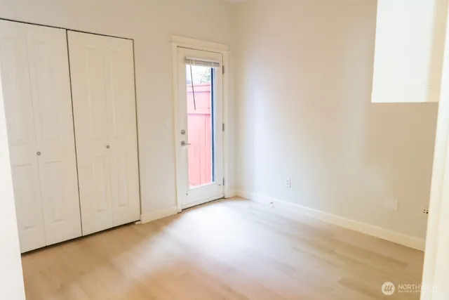 a view of an empty room with a closet