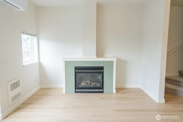 a view of a kitchen with a sink and refrigerator