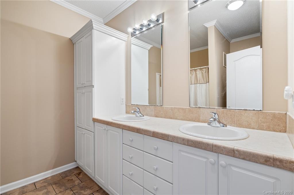 135 Ridge Field Drive Hendersonville, NC 28792 - Photo 14 of 28 a bathroom with a sink and a mirror