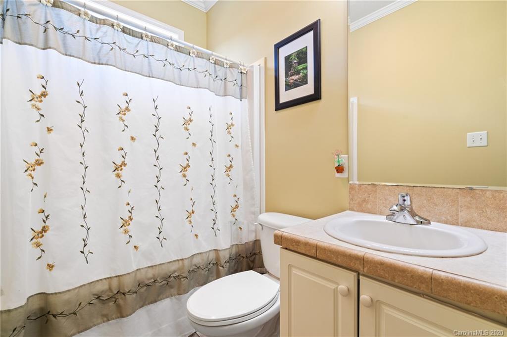 135 Ridge Field Drive Hendersonville, NC 28792 - Photo 17 of 28 a bathroom with a sink toilet and shower