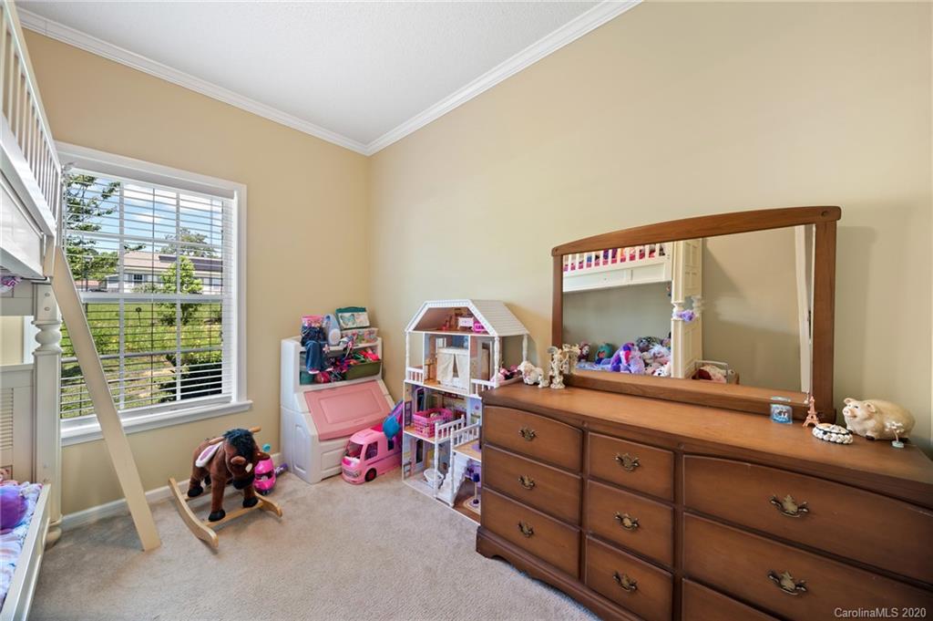 135 Ridge Field Drive Hendersonville, NC 28792 - Photo 19 of 28 a living room with baby toys