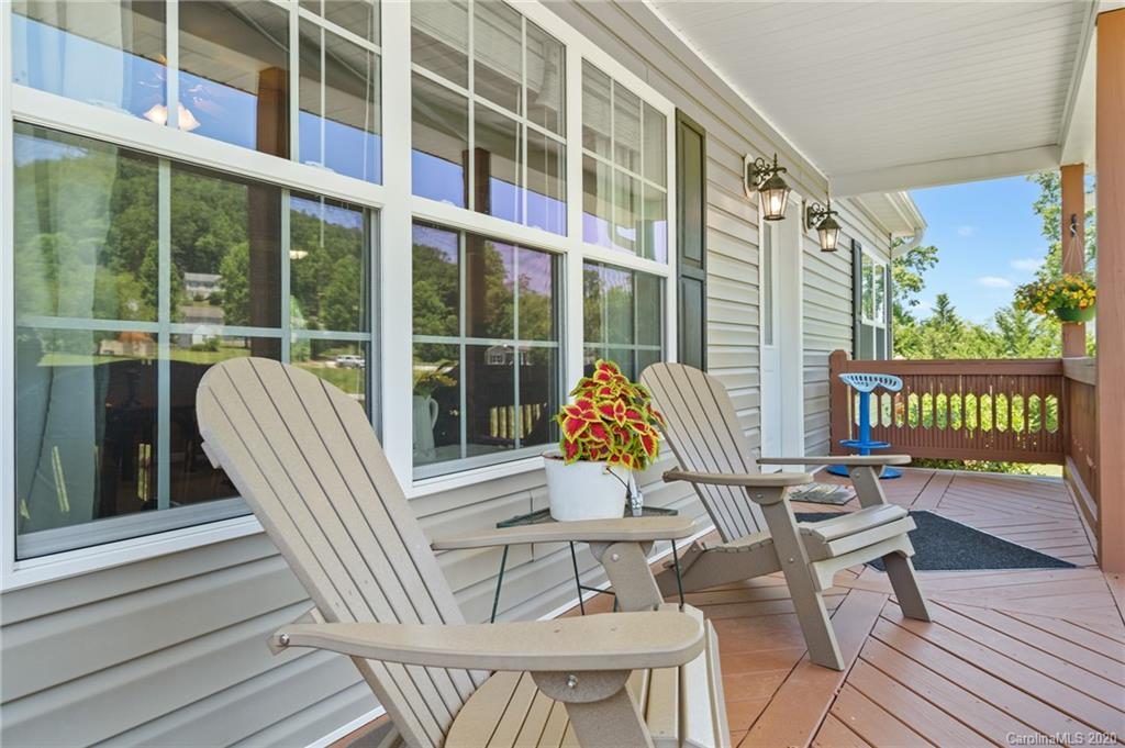 135 Ridge Field Drive Hendersonville, NC 28792 - Photo 20 of 28 a view of a balcony with a potted plant and wooden floor
