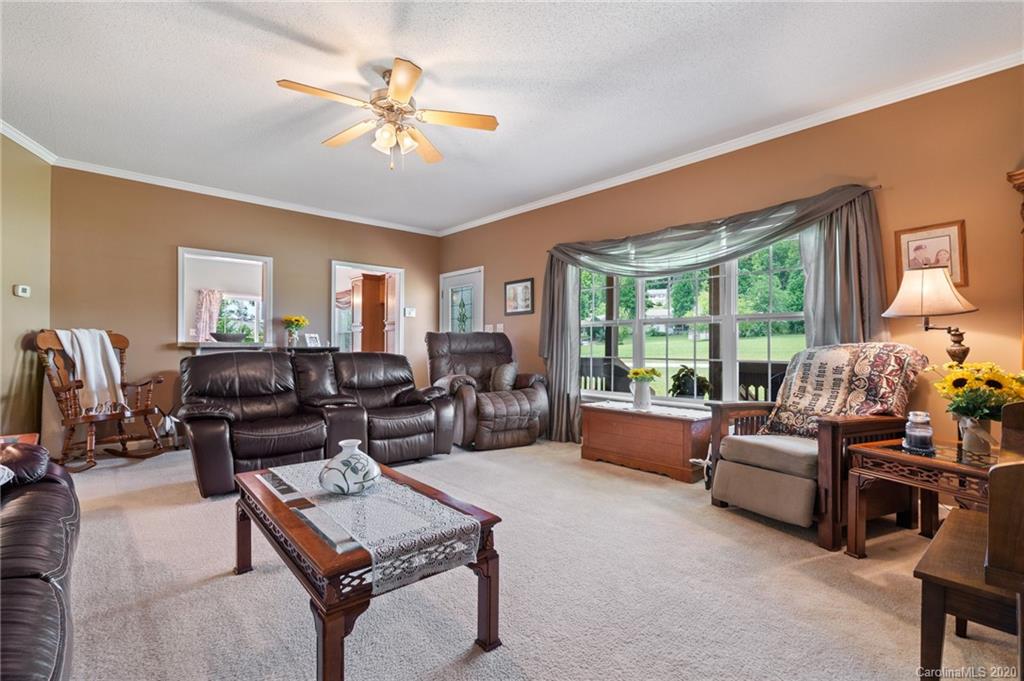 135 Ridge Field Drive Hendersonville, NC 28792 - Photo 3 of 28 a living room with furniture and a large window