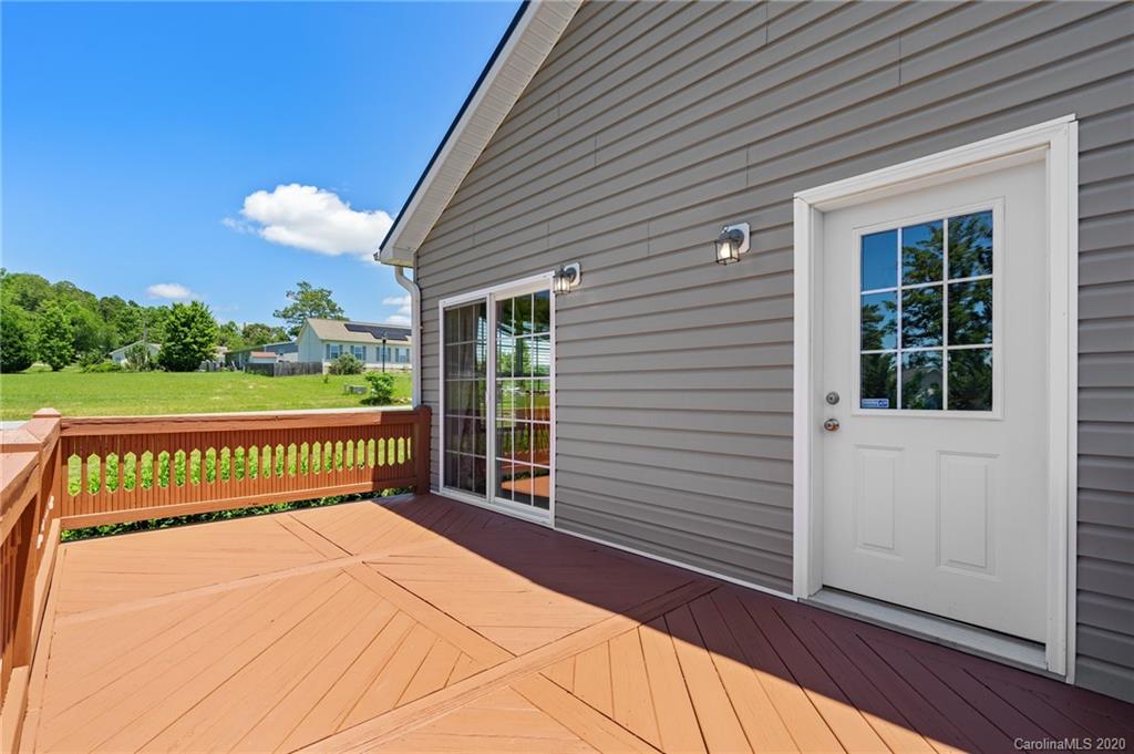 135 Ridge Field Drive Hendersonville, NC 28792 - Photo 22 of 28 a view of a wooden deck