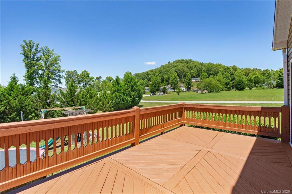 135 Ridge Field Drive Hendersonville, NC 28792 - Photo 23 of 28 a view of a street with wooden fence
