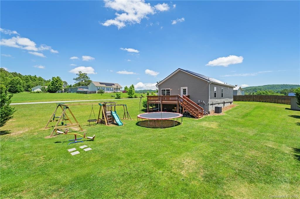 135 Ridge Field Drive Hendersonville, NC 28792 - Photo 28 of 28 a view of a house with a big yard