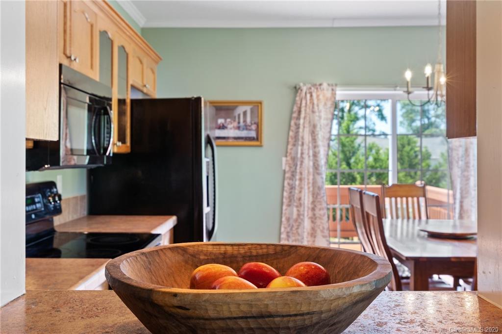 135 Ridge Field Drive Hendersonville, NC 28792 - Photo 6 of 28 a view of table and chairs in kitchen