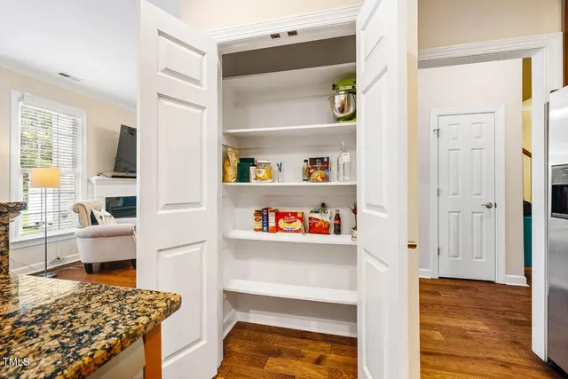 a view of kitchen and utility room with wooden floor