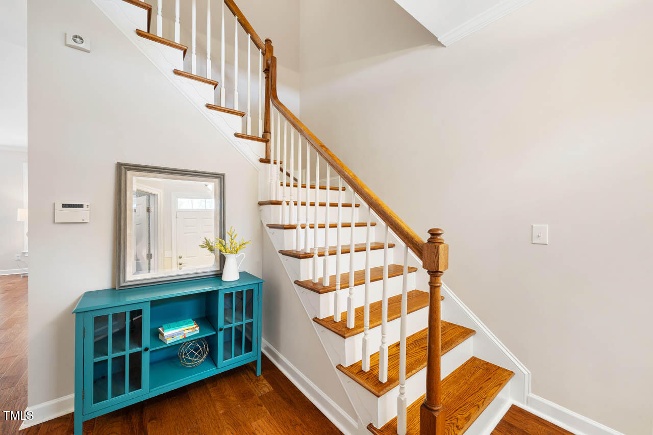 5515 South Roxboro Street, Unit 4 Durham, NC 27713 - Photo 13 of 34 a view of staircase with white walls and a window